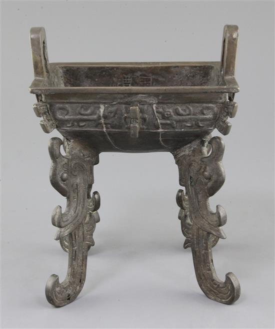 A Chinese archaic bronze quadruped ritual food vessel, Fangding, early Western Zhou dynasty, 22.7cm high, 17.5cm wide, repairs and lack